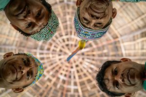 The Shipibo leaders of El Centro Inka Meraya facing the camera from a worm's eye shot.